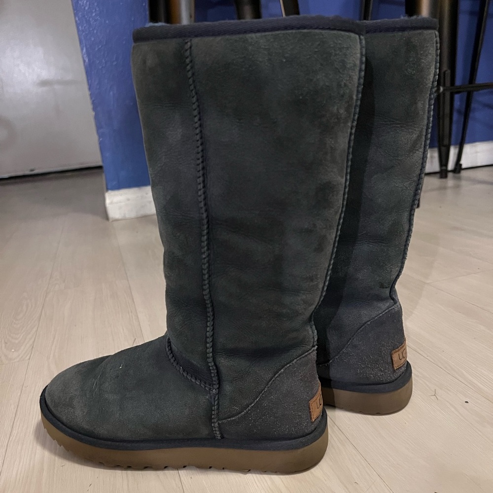 Women’s faded blue Ugg boots tall size 9.